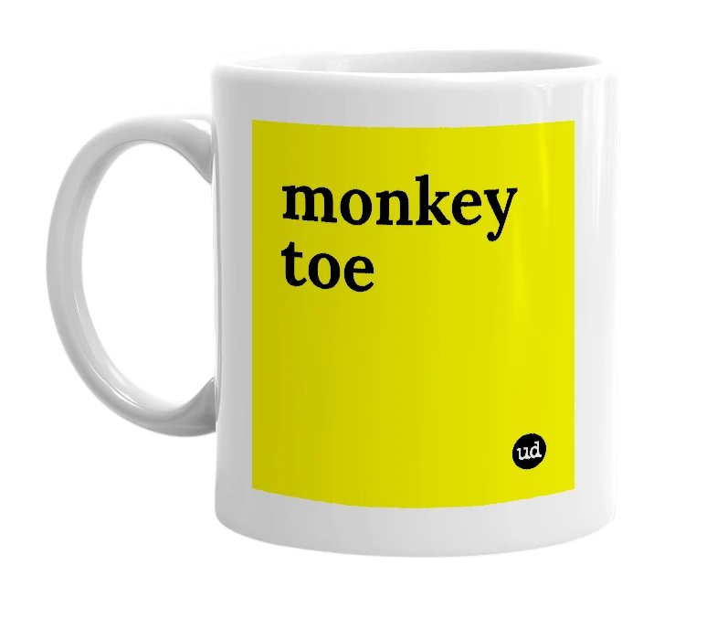 White mug with 'monkey toe' in bold black letters