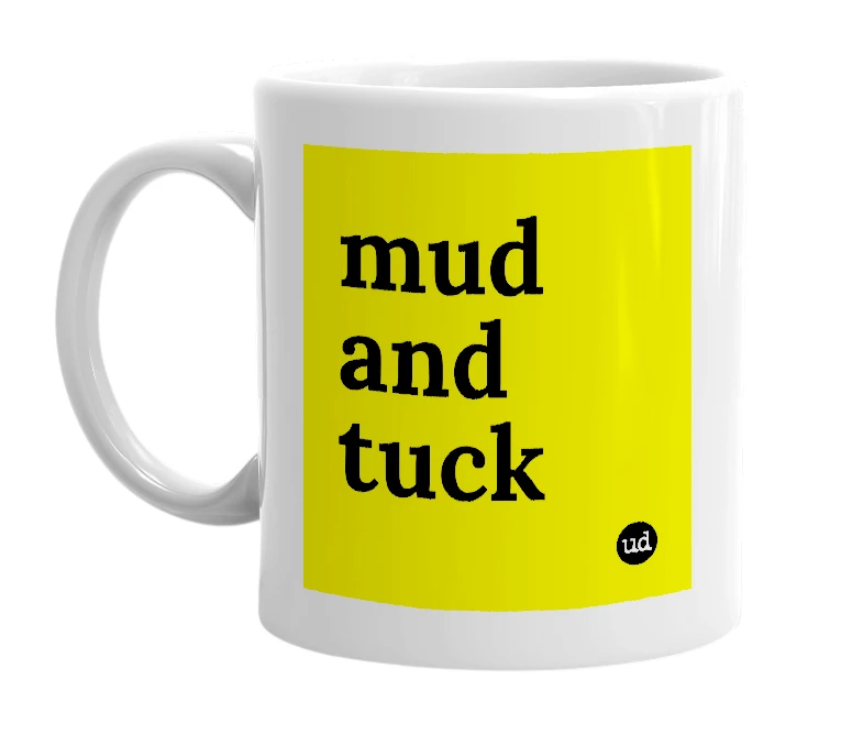 White mug with 'mud and tuck' in bold black letters