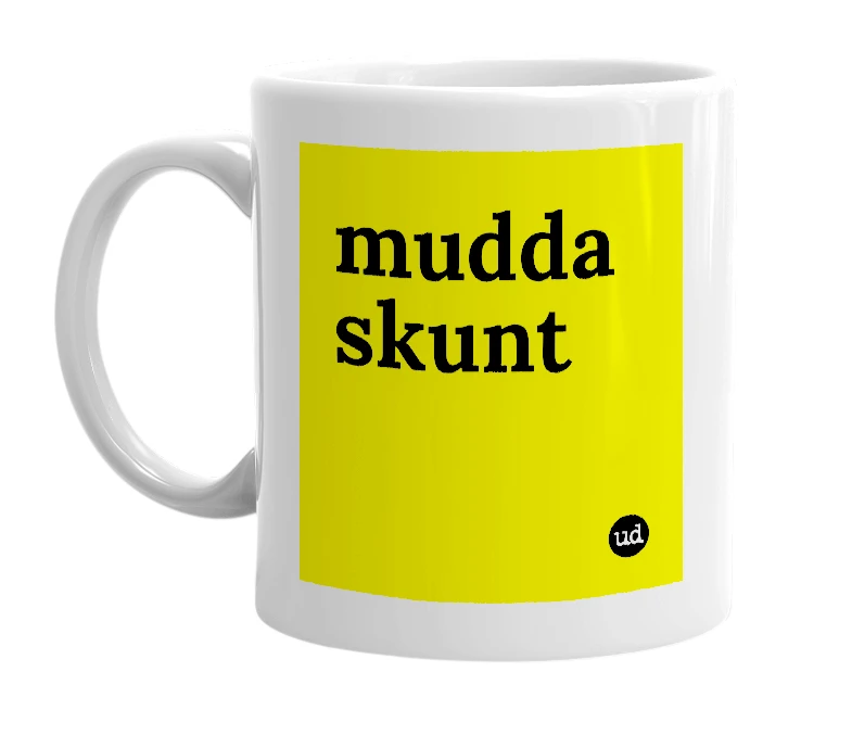 White mug with 'mudda skunt' in bold black letters