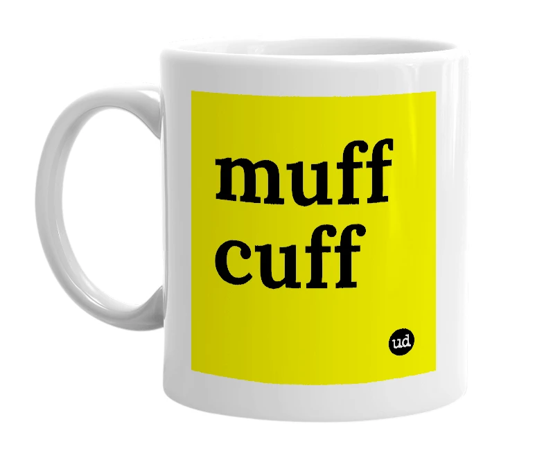 White mug with 'muff cuff' in bold black letters