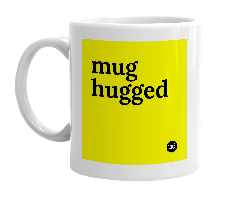 White mug with 'mug hugged' in bold black letters
