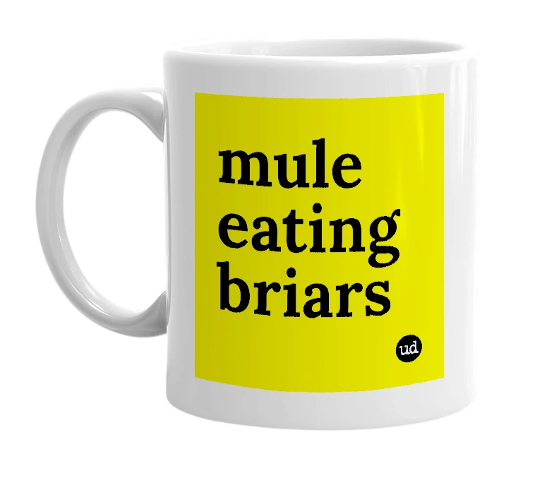 White mug with 'mule eating briars' in bold black letters