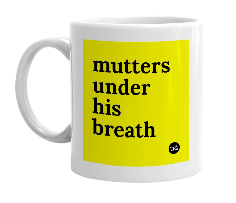 White mug with 'mutters under his breath' in bold black letters