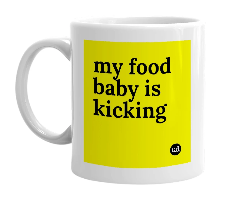 White mug with 'my food baby is kicking' in bold black letters