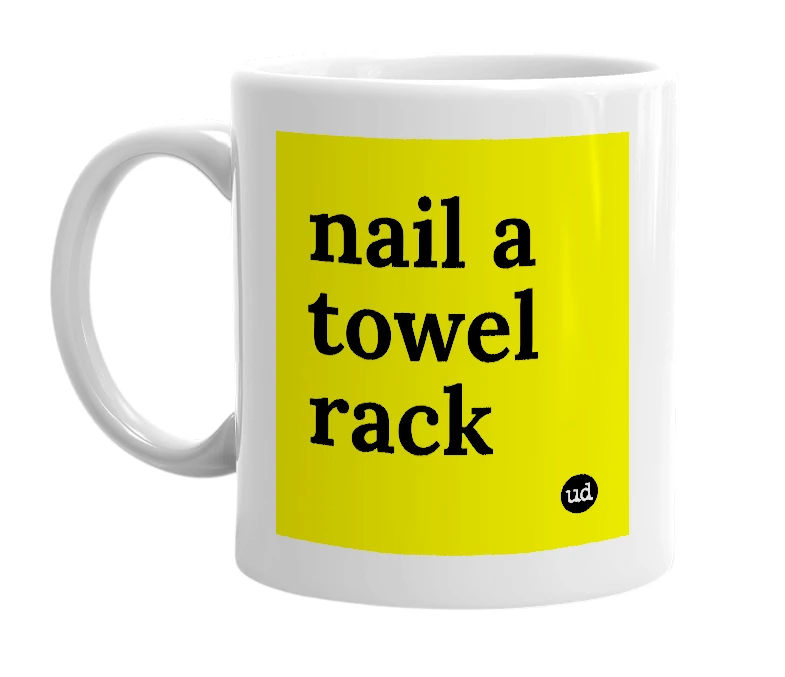 White mug with 'nail a towel rack' in bold black letters