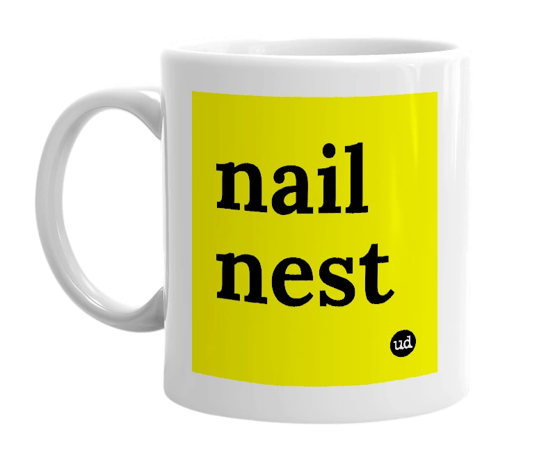 White mug with 'nail nest' in bold black letters