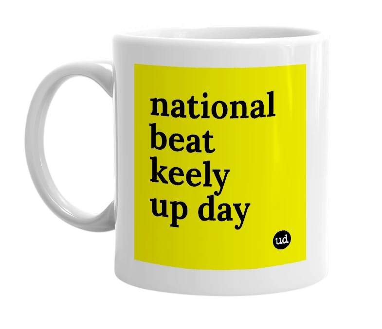 White mug with 'national beat keely up day' in bold black letters