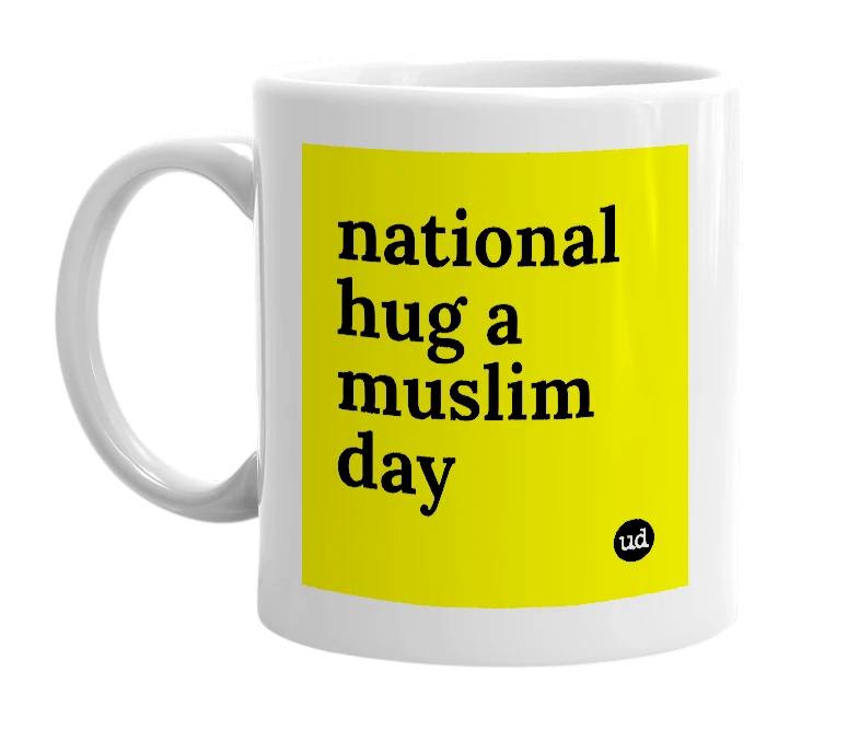 White mug with 'national hug a muslim day' in bold black letters