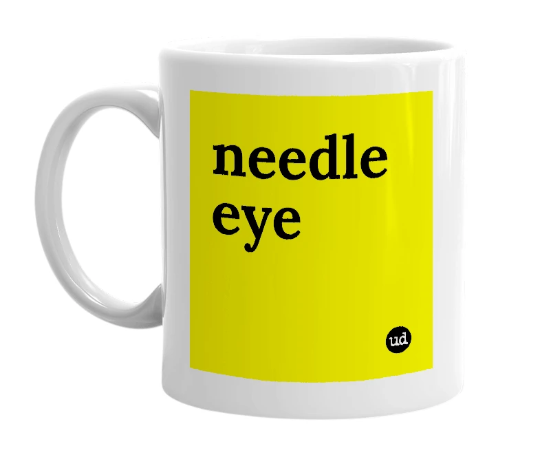 White mug with 'needle eye' in bold black letters