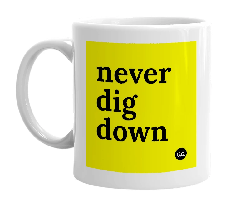 White mug with 'never dig down' in bold black letters