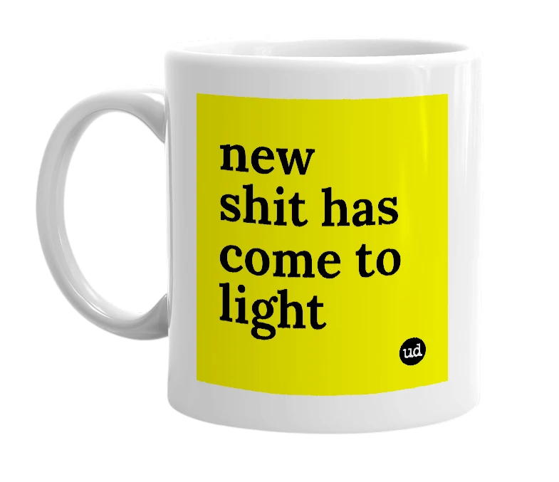 White mug with 'new shit has come to light' in bold black letters