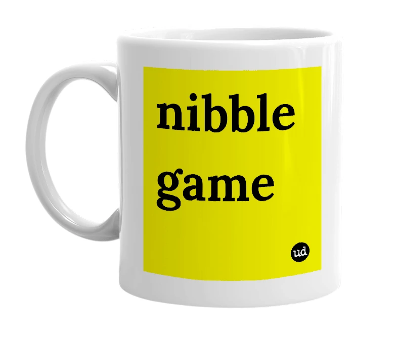 White mug with 'nibble game' in bold black letters