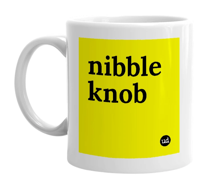 White mug with 'nibble knob' in bold black letters