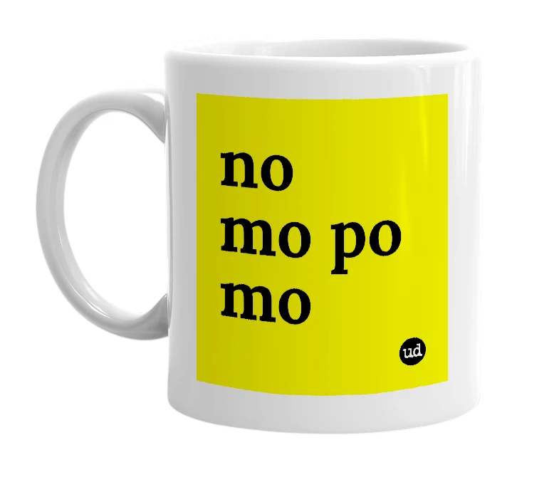 White mug with 'no mo po mo' in bold black letters