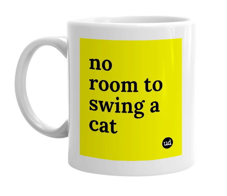White mug with 'no room to swing a cat' in bold black letters