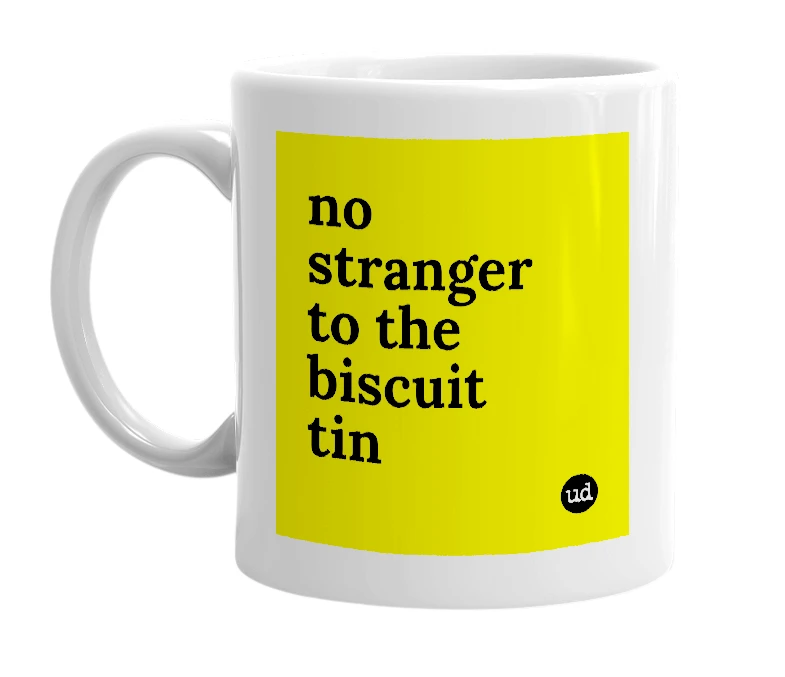 White mug with 'no stranger to the biscuit tin' in bold black letters
