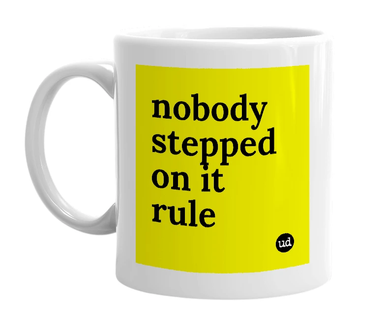 White mug with 'nobody stepped on it rule' in bold black letters