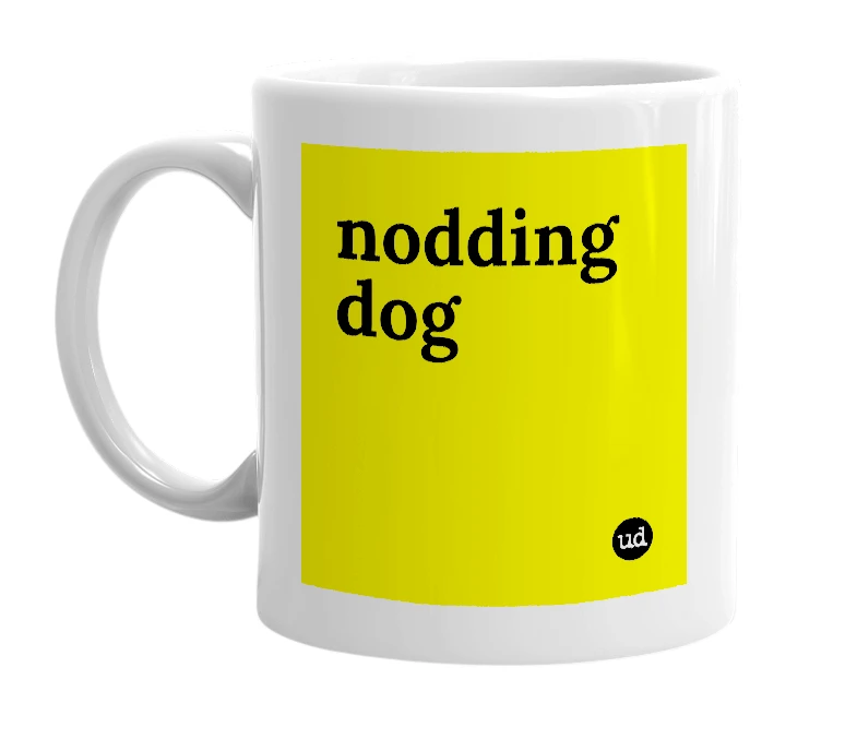 White mug with 'nodding dog' in bold black letters