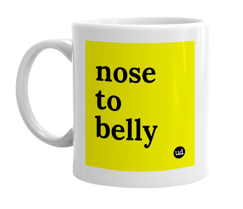 White mug with 'nose to belly' in bold black letters