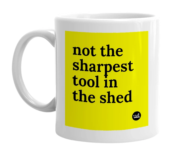 White mug with 'not the sharpest tool in the shed' in bold black letters