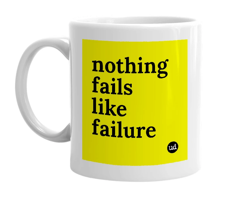 White mug with 'nothing fails like failure' in bold black letters