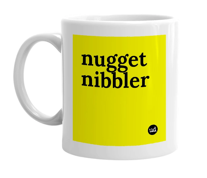 White mug with 'nugget nibbler' in bold black letters