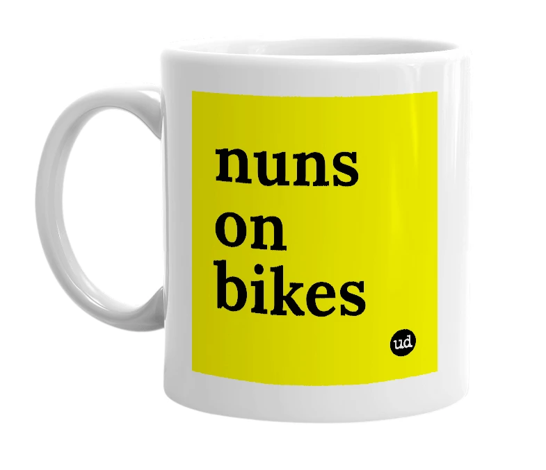 White mug with 'nuns on bikes' in bold black letters