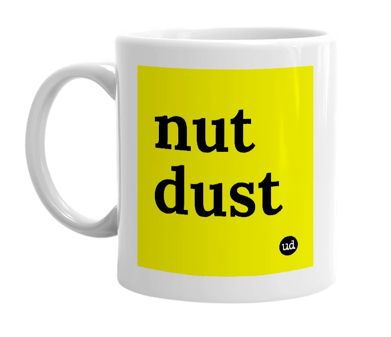 White mug with 'nut dust' in bold black letters