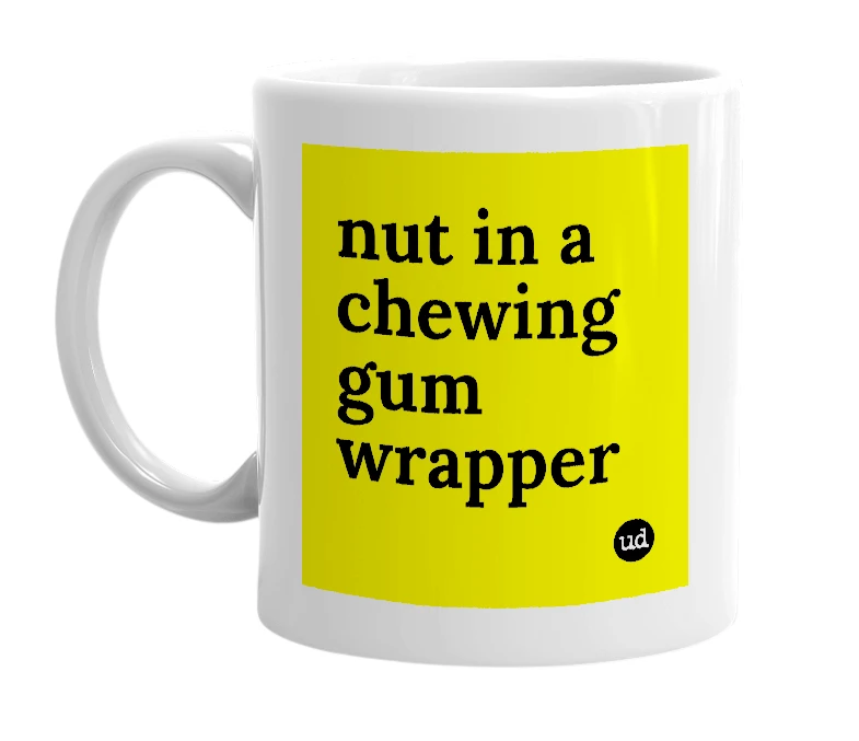 White mug with 'nut in a chewing gum wrapper' in bold black letters