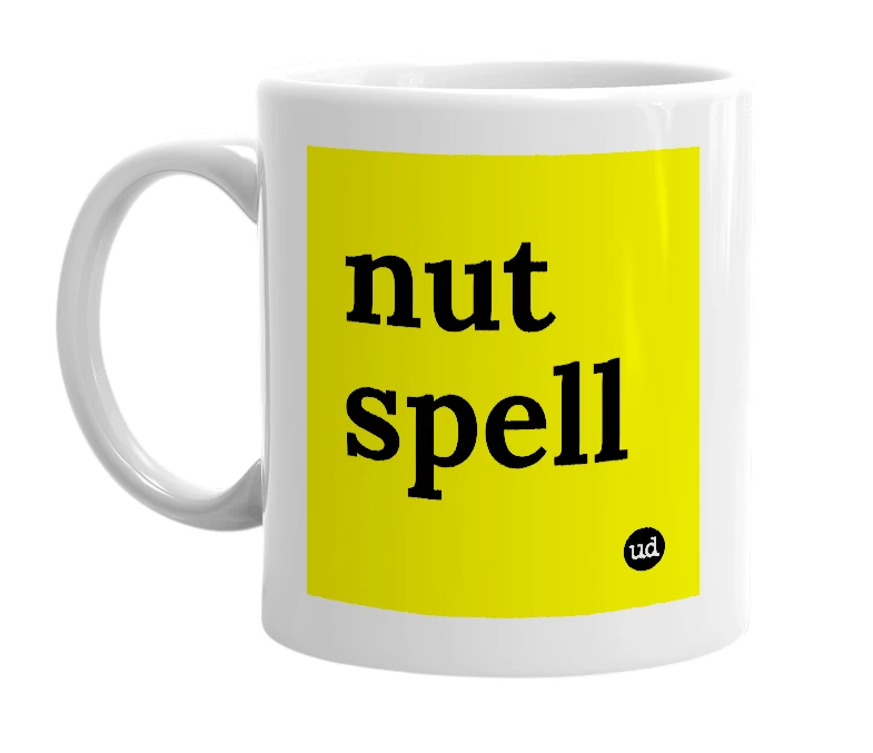 White mug with 'nut spell' in bold black letters