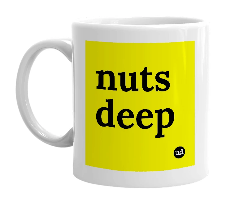 White mug with 'nuts deep' in bold black letters