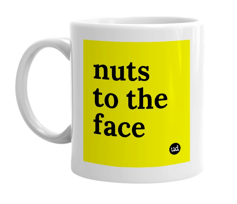 White mug with 'nuts to the face' in bold black letters