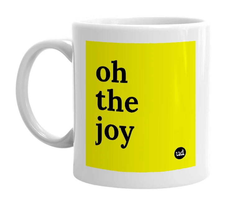 White mug with 'oh the joy' in bold black letters