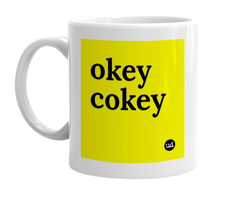 White mug with 'okey cokey' in bold black letters