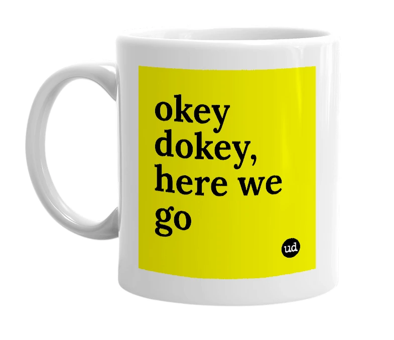 White mug with 'okey dokey, here we go' in bold black letters