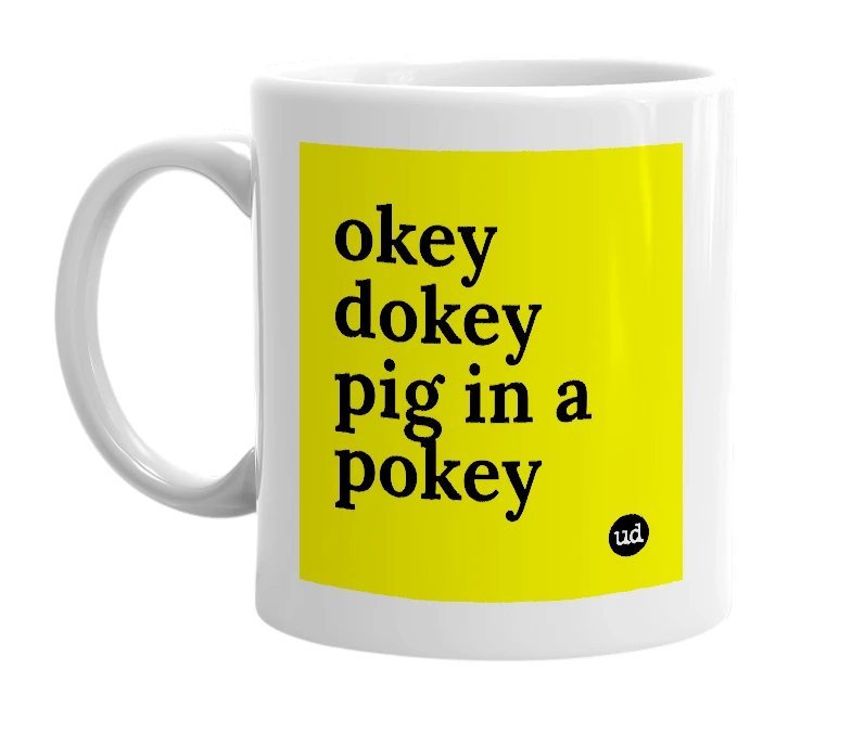 White mug with 'okey dokey pig in a pokey' in bold black letters