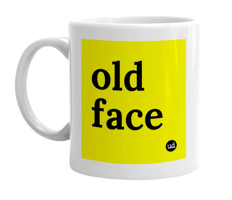 White mug with 'old face' in bold black letters