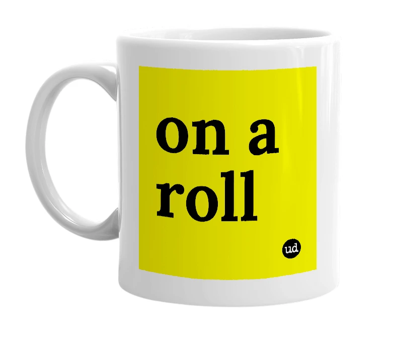 White mug with 'on a roll' in bold black letters