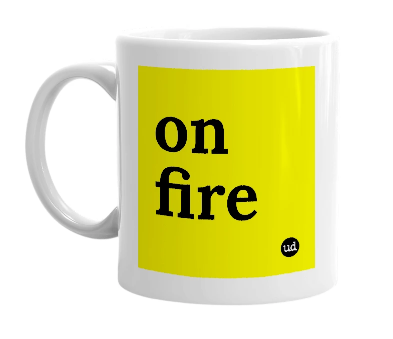 White mug with 'on fire' in bold black letters