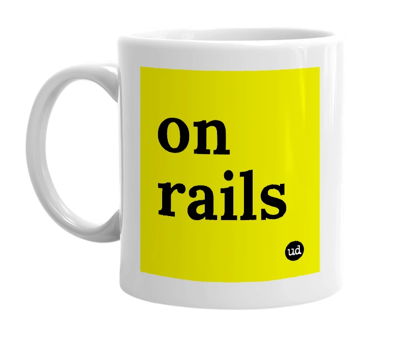 White mug with 'on rails' in bold black letters