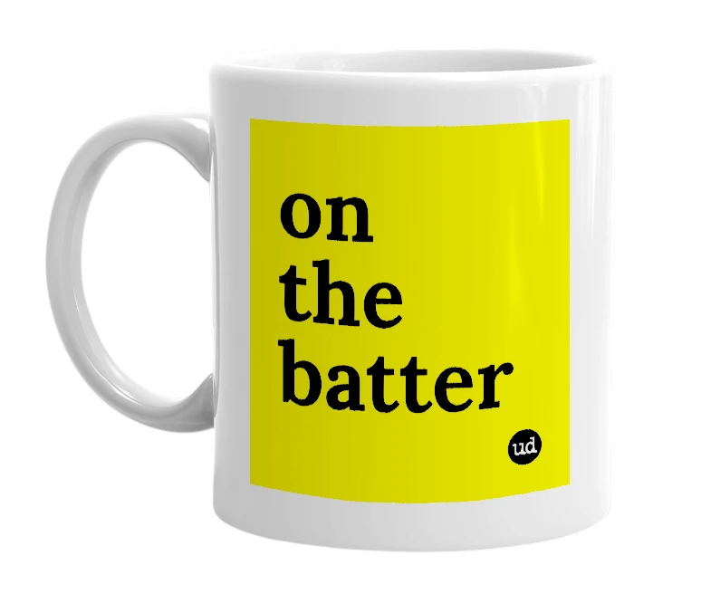 White mug with 'on the batter' in bold black letters