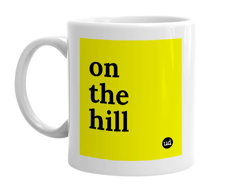 White mug with 'on the hill' in bold black letters