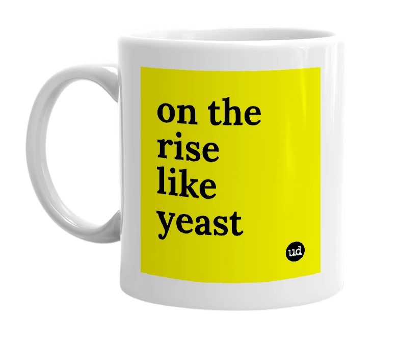 White mug with 'on the rise like yeast' in bold black letters