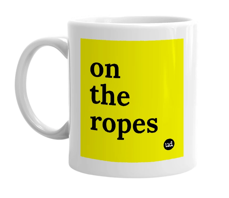 White mug with 'on the ropes' in bold black letters