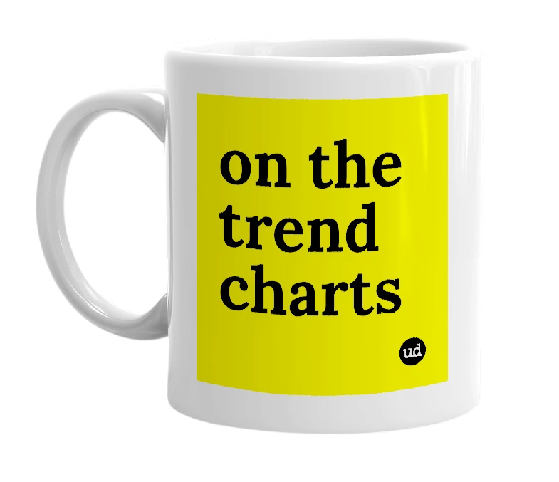 White mug with 'on the trend charts' in bold black letters