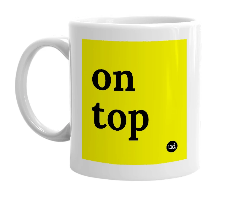 White mug with 'on top' in bold black letters