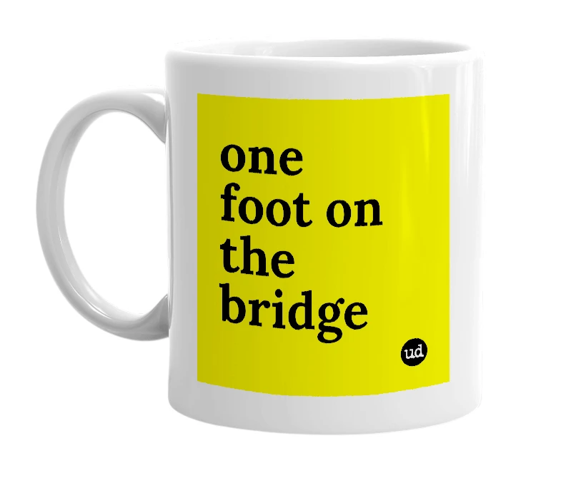 White mug with 'one foot on the bridge' in bold black letters