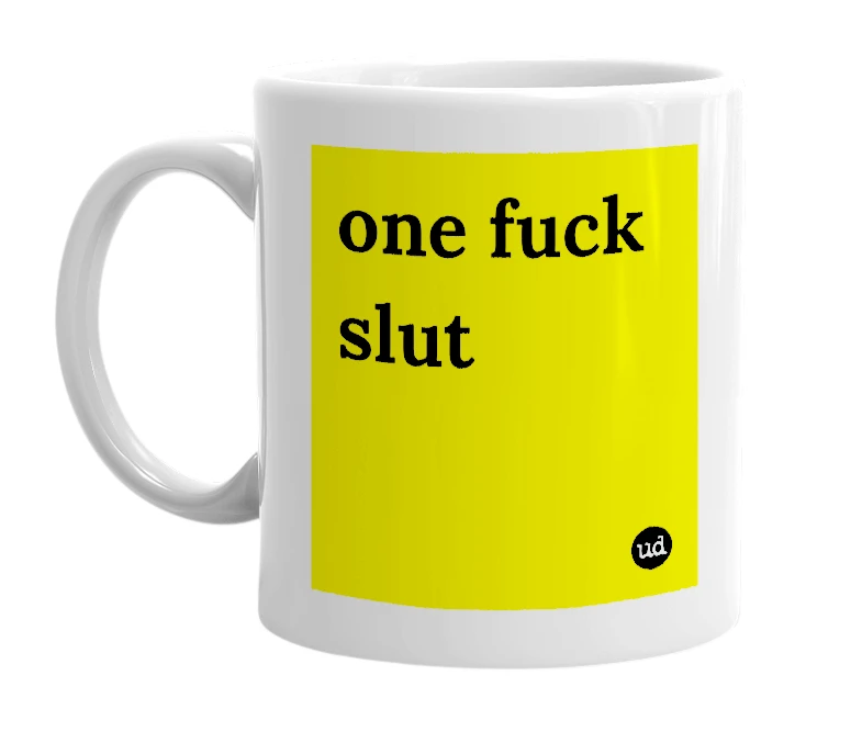 White mug with 'one fuck slut' in bold black letters