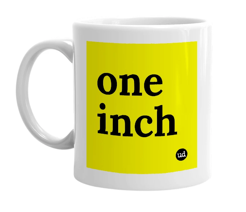 White mug with 'one inch' in bold black letters