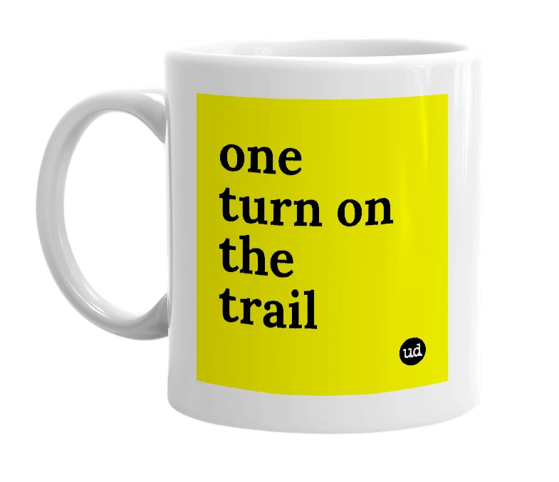 White mug with 'one turn on the trail' in bold black letters